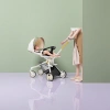 White baby stroller with colorful sunshade, black seat and yellow push rod Application Scenario
